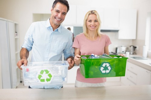 Recyclable materials being loaded into an enclosed skip